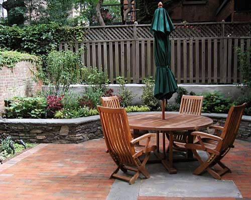 brick and stone patio, built in planter with field stone wall